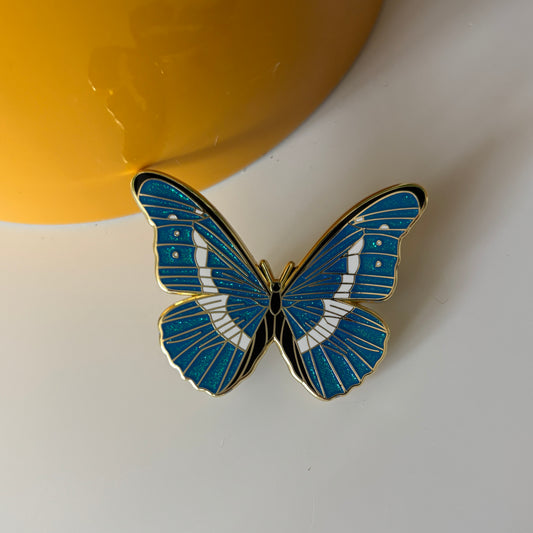 Blue Glitter Butterfly Enamel Pin – Elegant Gold Outline Lapel Pin