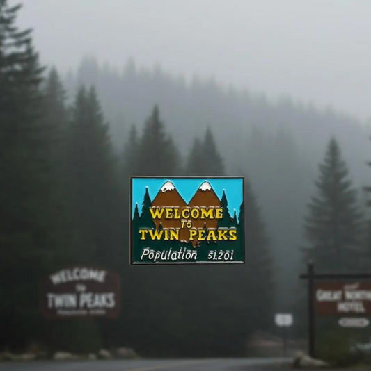 Welcome sign to Twin Peaks with foggy forest in the background enamel pin