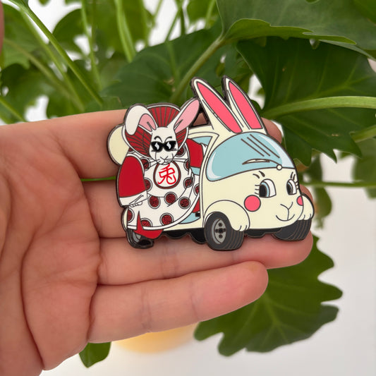 Cartoon character  boss rabbit in a car held by a hand with a green leafy background